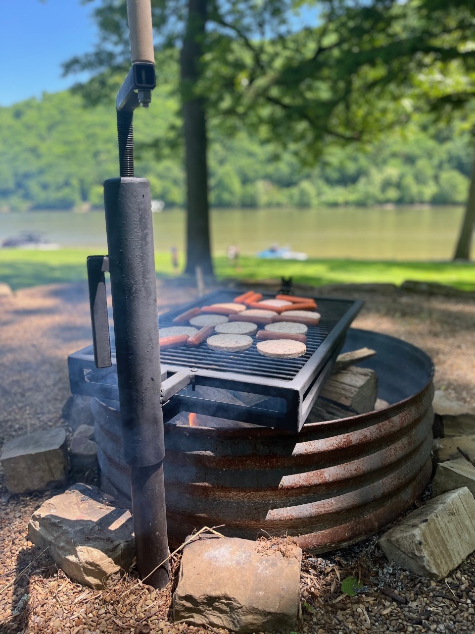 Grill hotdogs and hamburgers. River view.